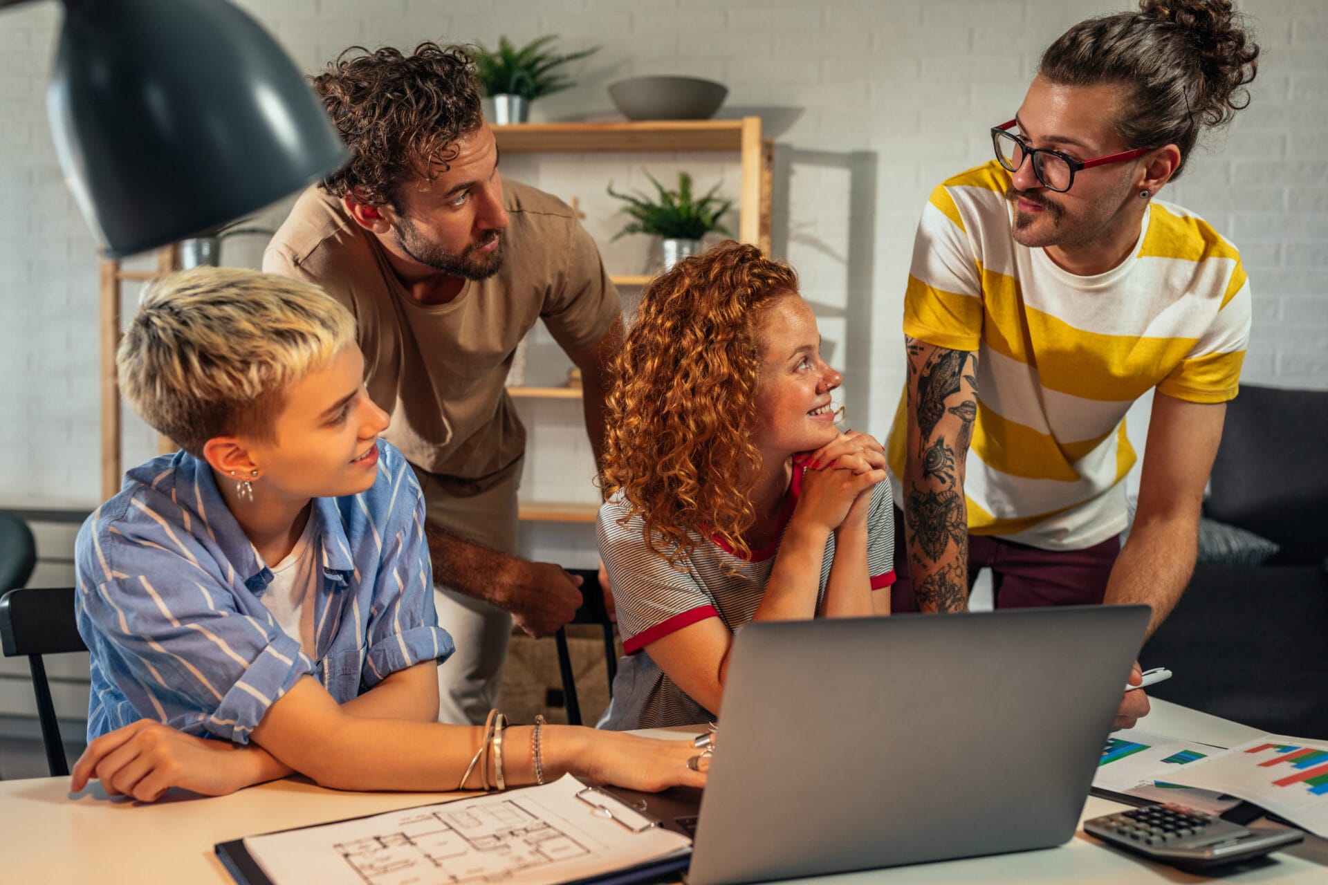 Group of young coworkers working together on new project