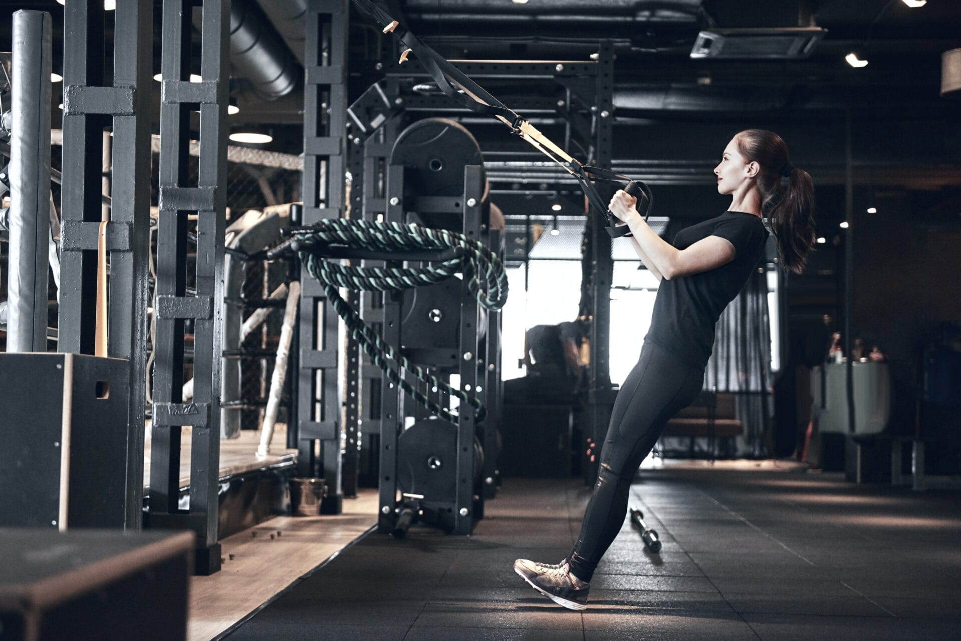 Beautiful young woman while training in the gym